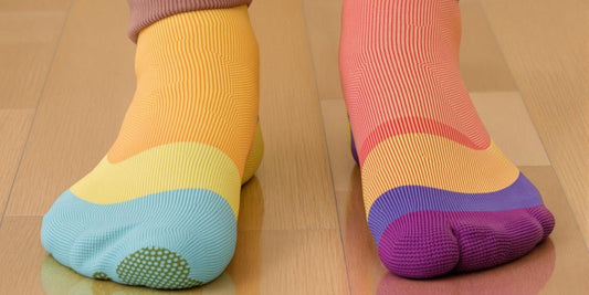 Close-up of colorful anti slip socks on wooden floor