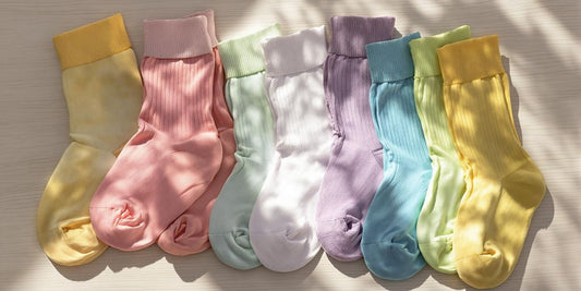 Colorful diabetic socks arranged on a wooden surface