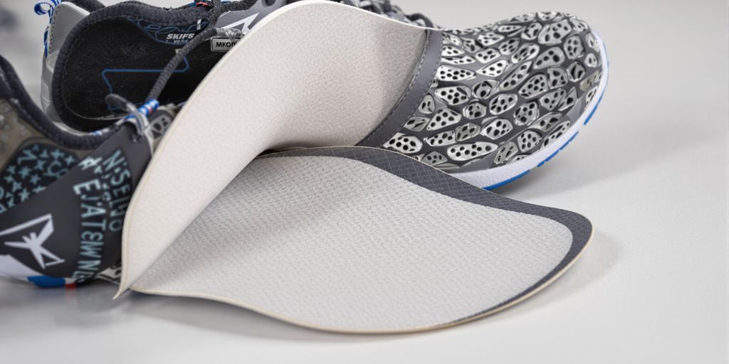 Memory foam shoe inserts inside athletic sneakers close-up