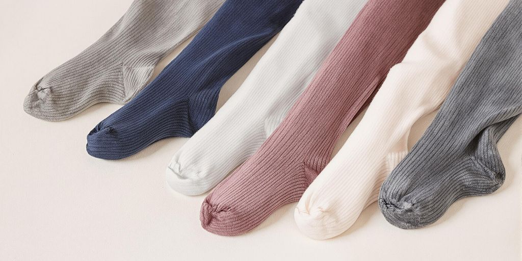 Colorful wide leg knee high socks arranged on soft background.