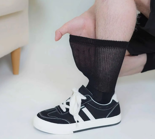 Close-up of soft diabetic socks on a wooden surface.