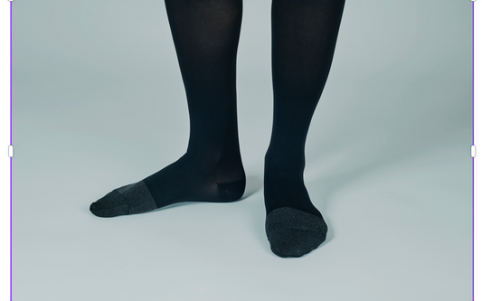 Close-up of moisture-wicking socks on a wooden surface.