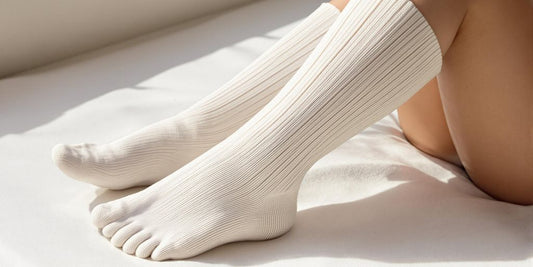 Person wearing comfortable knee-high diabetic socks indoors