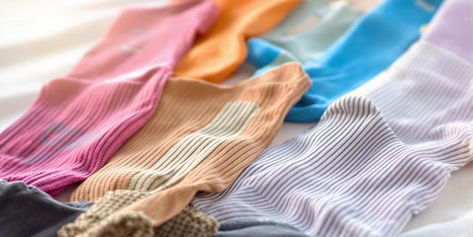 Colorful medical socks arranged on a white surface.