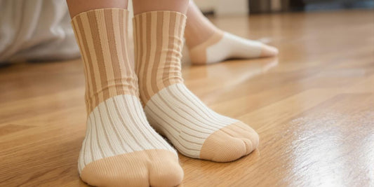 Close-up view of diabetic socks on feet under natural light.